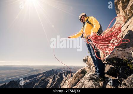 Man hiking and climbing the Grand Teton in Grand Teton National Park, Wyoming. Stock Photo