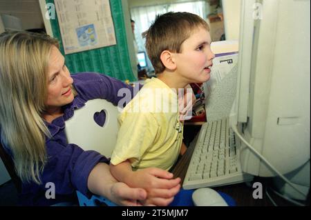 Autistic Child with Computer Stock Photo - Alamy