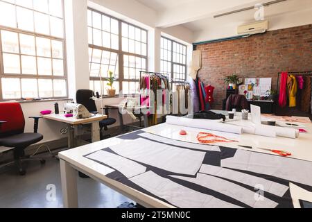 Designs, fabric and tailor's tools in sunny studio Stock Photo