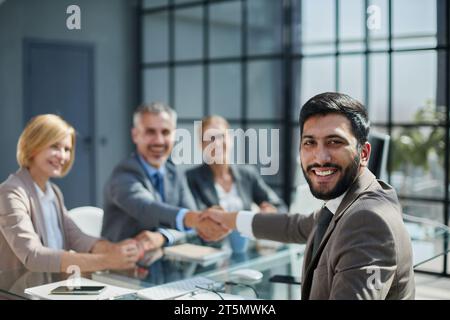 Multicultural professionals project managers group negotiating in boardroom at meeting. Stock Photo