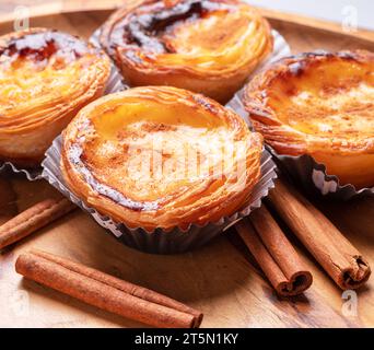 Pastel De Nata Tarts And Cinnamon Sticks Isolated On White Background 