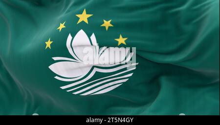 Close-up of Macau flag waving. Green area, lotus flower center, 5 stars atop, stylized bridge and waters below. 3d illustration render. Selective focu Stock Photo