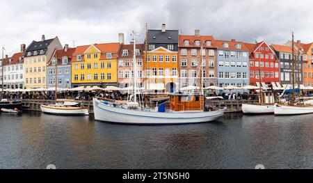 Copenhagen, Denmark - October 17, 2023: General view of the main street of Nyhavn neighborhood in Copenhagen, Denmark. Stock Photo
