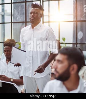 Business People Having Board Meeting In Modern Office Stock Photo