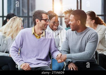 Happy multiethnic employees having fun while discussing project, Stock Photo