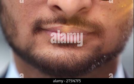 Close up cropped half face photo of stylish young man's bristle with thoughtful Stock Photo
