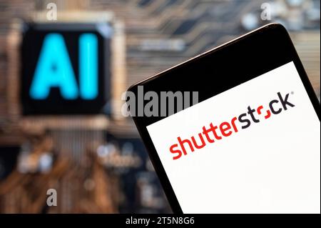 China. 03rd Nov, 2023. In this photo illustration, the American provider of stock photography, stock footage, stock music, and editing tools Shutterstock logo seen displayed on a smartphone with an Artificial intelligence (AI) chip and symbol in the background. Credit: SOPA Images Limited/Alamy Live News Stock Photo