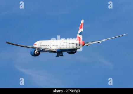 British Airways Boeing 777-36NER, registration G-STBC departing London Heathrow in sunny conditions on a September afternoon Stock Photo