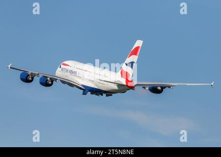 British Airways A380-841, registration G-XLEG flying out of London Heathrow in perfect conditions on a late autumn afternoon Stock Photo