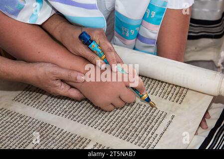 A Bar Mitzvah Boy Is Helped By His Father To Use A Pointer Or Yad To 