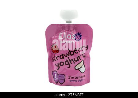 Irvine, Scotland, UK-July 21, 2023: Ella’s kitchen branded organic strawberry yogurt in recyclable package and top with graphics symbols and icons rel Stock Photo