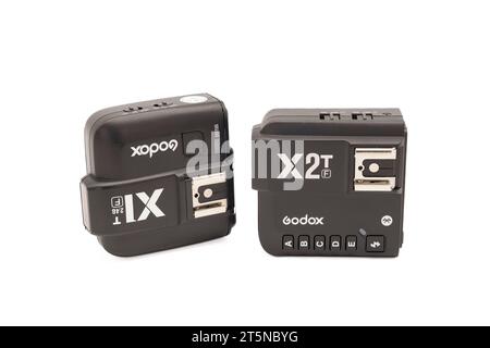Irvine, Scotland, UK - October  26, 2023: Godox  branded flash triggers, X1T (F) and the X2T (F) Both made for the fuji camera systems for studio and Stock Photo