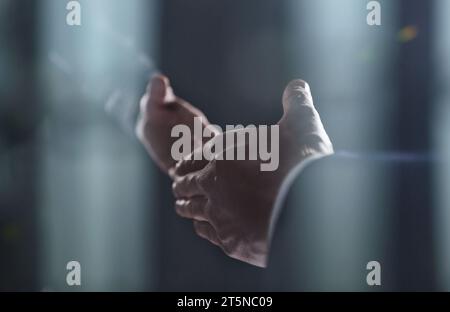 Close-up image of handshake between two colleagues. Stock Photo