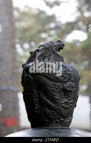 bronze animal head decoration on incense burner, closeup of photo Stock Photo