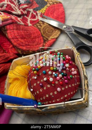 Still life of sewing notions including a pincushion and scissors Stock Photo