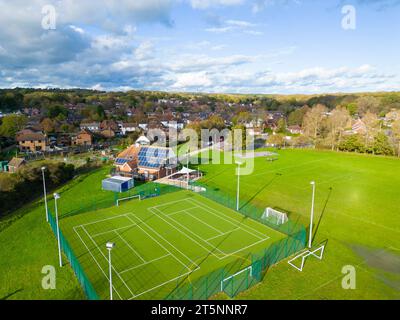 Aerial view of a sports complex with tennis courts and soccer fields in a suburban area on a sunny day, Hamstreet village, Ashford, Kent Stock Photo