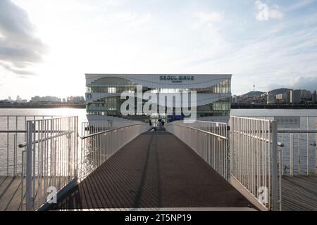 Seoul, South Korea - 14 July 2022: Seoul Wave Art Center building, floating Starbucks on Hangang River or Han River with sunset sky. Stock Photo