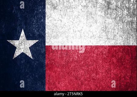 Close-up of the grunge Texas state flag. Dirty Texas state flag on a metal surface. Stock Photo