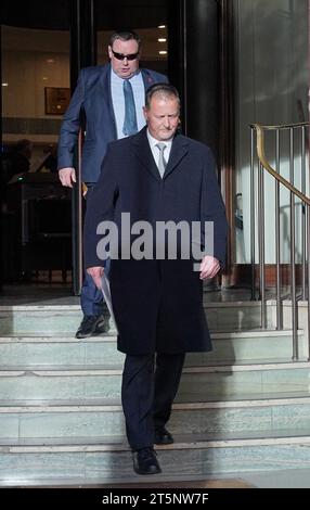 Metropolitan police officers leave after raiding an address in Brixton ...