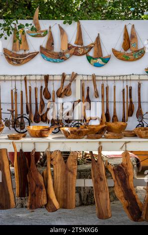 selection of handcrafted olive wood sculptures and models gifts for sale at a tourist shop or gift souvenir shop on the greek island of zante or zakyn. Stock Photo