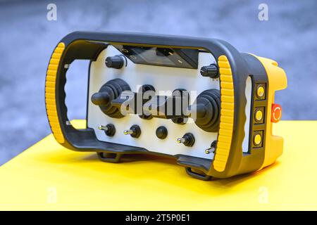 Rugged Wireless Remote Control Unit for Construction Machine Stock Photo
