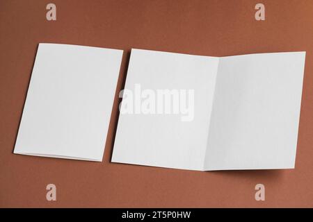 High angle view folded unfolded blank white papers Stock Photo