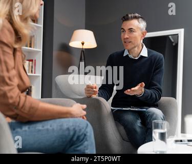 Mid shot patient talking man therapist Stock Photo