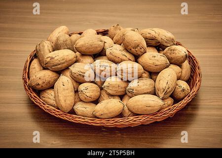Pecans on the table in a wicker basket. Stock Photo