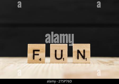 Word fun spelt with wooden letters Stock Photo