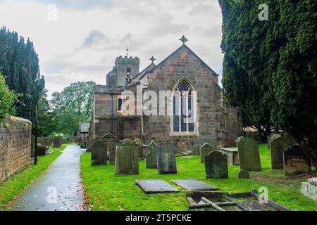 All Saints Church in Ripley sits in a  picturesque estate village near Harrogate, best-known as the home of Ripley Castle, one of the great historic h Stock Photo