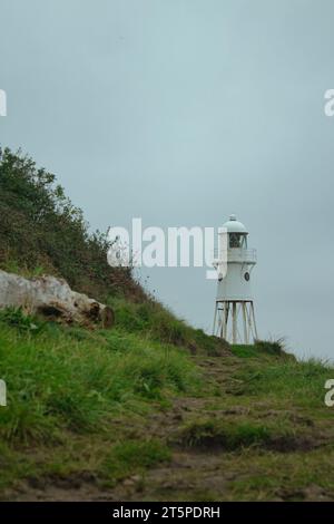 Black Nore Lighthouse in Portishead. Photo taken in October 2023 during a rainy and misty day. This lighthouse is located close to the city of Bristol Stock Photo