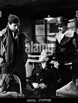 Gary Merrill (left), Oskar Werner (center), on-set of the film, 'Decision before Dawn', 20th Century-Fox, 1951 Stock Photo
