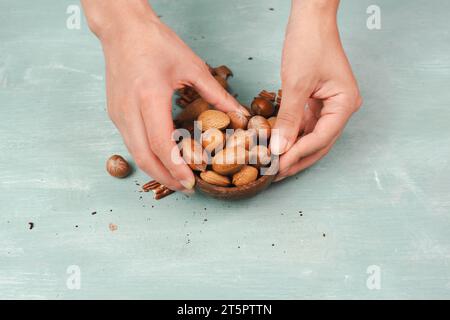 Bowl of nuts, mix variety of almonds, hazelnuts and pecan nuts, healthy food and lifestyle Stock Photo