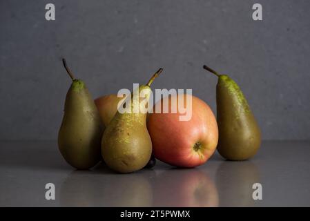 Autumn fruit still life with pears and apples on the grey background Stock Photo