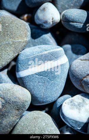 Close up of stones and pebbles on a beach in Cornwall, England, UK Stock Photo