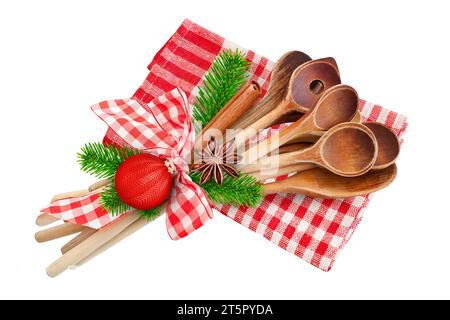 Christmas and wooden cooking spoons with cinnamon, fir branches, anise and decoration isolated on white background Stock Photo