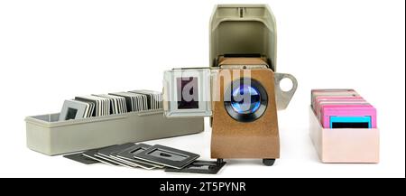 Old slide projector and set of slides isolated on white background. Retro equipment. Wide photo. Stock Photo