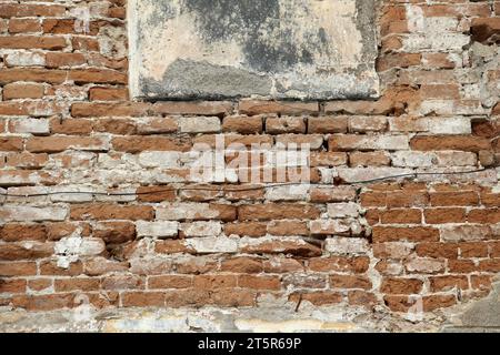 A fragment of the masonry wall of the old building Stock Photo
