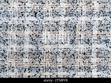 Fabric checkered in light colors beige, grey, black and grey close up.  Abstract background. Texture of fabric. Stock Photo