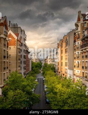 Paris, France - April 20, 2023: Parisians buildings seen from La coulée verte in Paris Stock Photo