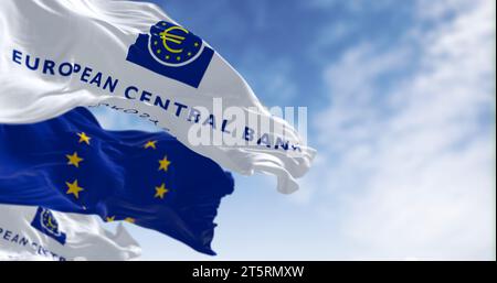 Frankfurt, DE, March 18 2023: Flags of the European Central Bank and European Union waving in the wind on a clear day. Illustrative editorial 3d illus Stock Photo