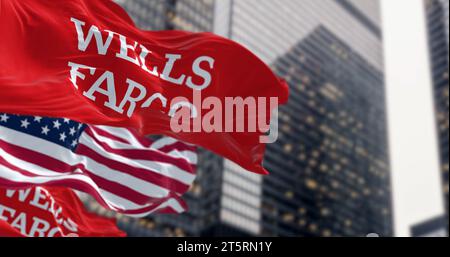 San Francisco, US, Oct. 1 2023: Wells Fargo bank and American flags waving in a financial district. Illustrative editorial 3d illustration. Finance an Stock Photo