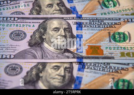 100 US dollars lined up as a background covering the screen Stock Photo