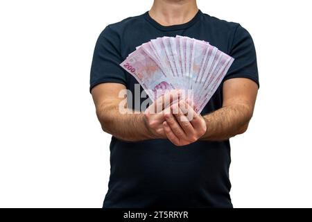 An unrecognizable person shows the Turkish lira with both hands towards the camera Stock Photo