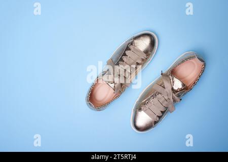 Shiny sneakers with gold on sale detail