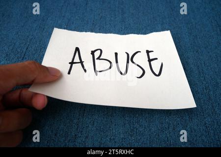 Message card with text Abuse. Concept of stop violence against Women, international women's day Stock Photo