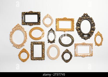 Empty vintage frames hanging on white wall Stock Photo - Alamy