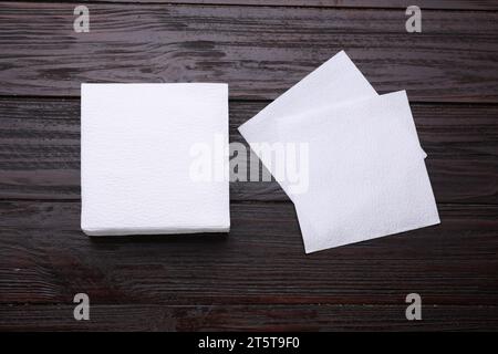 Clean paper tissues on wooden table, flat lay Stock Photo