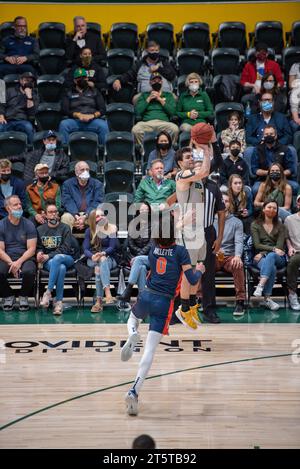 A college Basketball player slams down a dunk Stock Photo