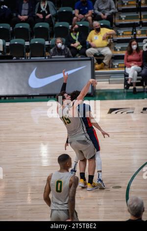College Basketball player Shooting a made shot Stock Photo